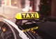 Vehicle with "Taxi" light/sign on its roof
