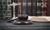 Gavel in foreground with books in background