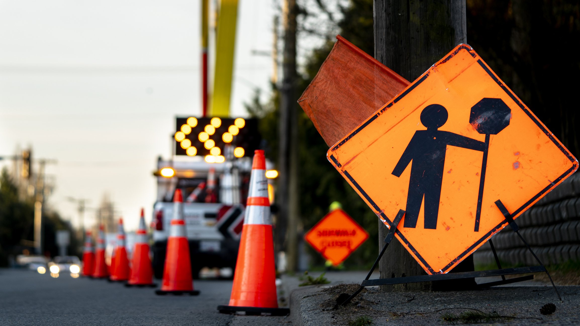 Image of road with pilons and construction sign