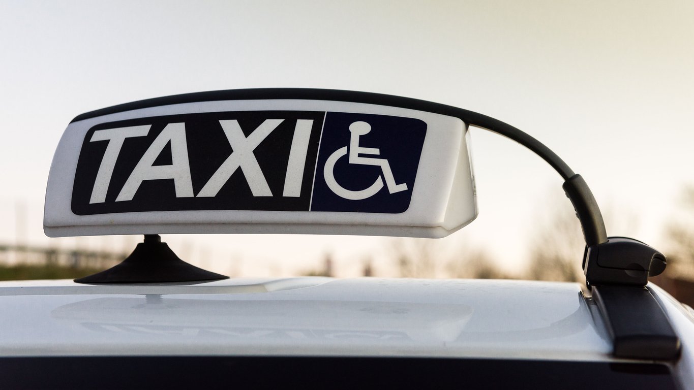 Image of taxi sign with wheelchair accessibility logo