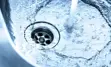 Water pouring down a drain