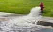 A fire hydrant being flushed