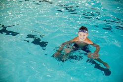child treading water in pool
