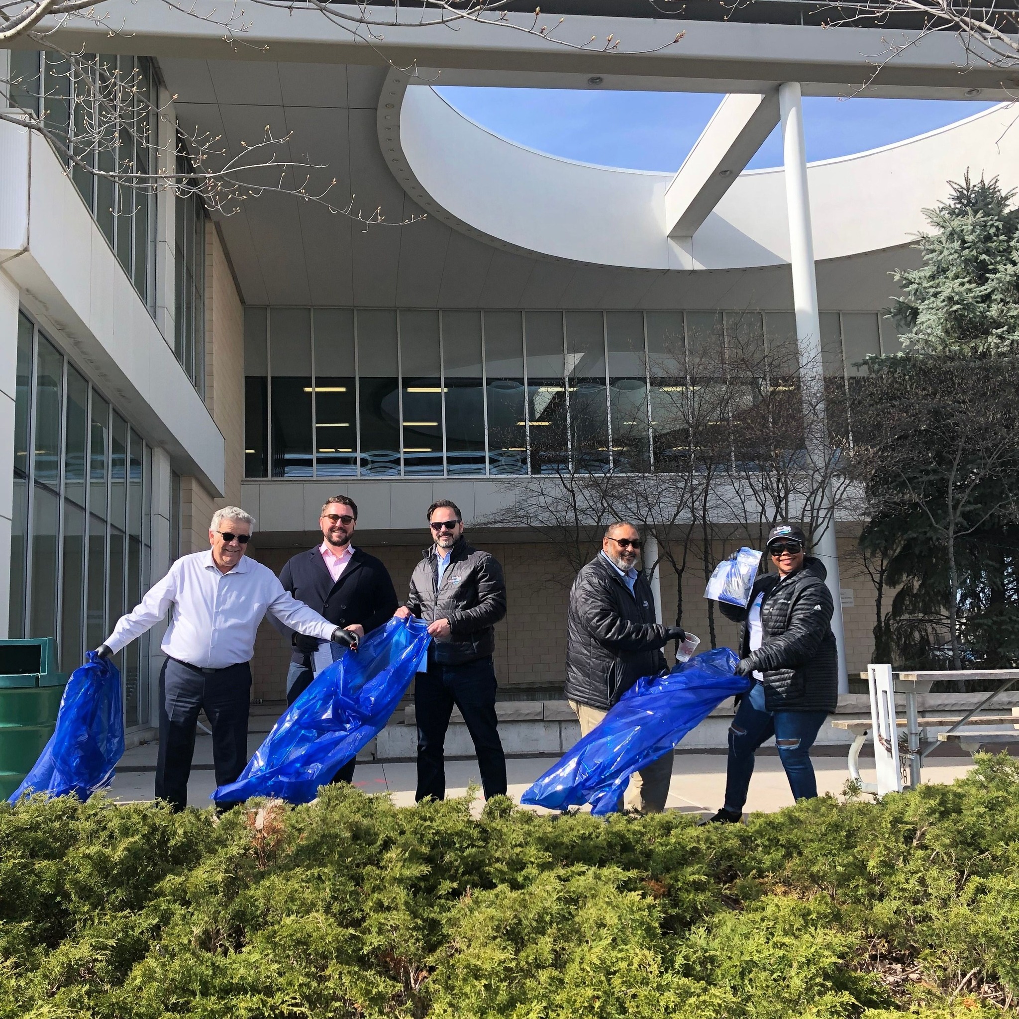 BWG Council members standing outside of the Leisure Centre holding clean up kits for Community Clean-up week.