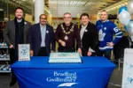 Mayor & Council cutting cake