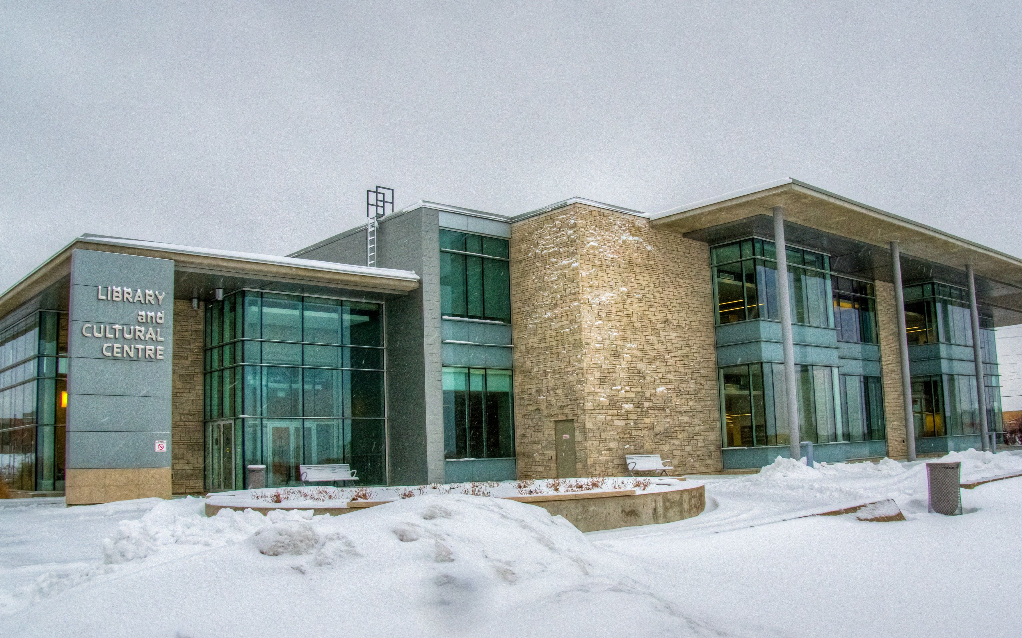 image of the bradford public library with some snow on the ground