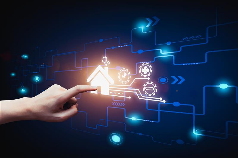 Image of hand pointing to digital touchscreen with a house on it