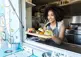Food truck owner serving food to a customer