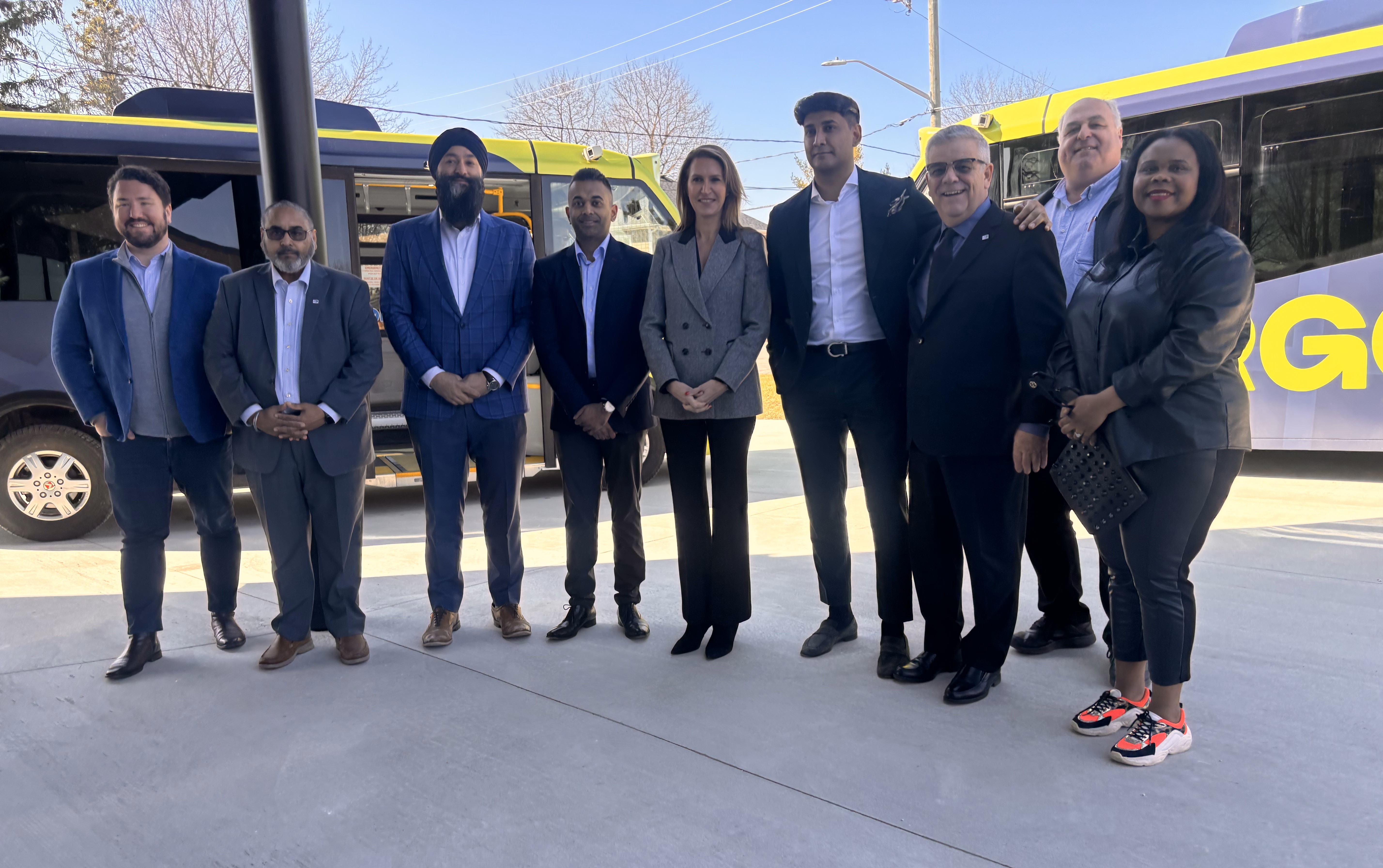 MPP Sarkaria, MPP Mulroney, Members of Argo and BWG Council standing in front of Argo busses