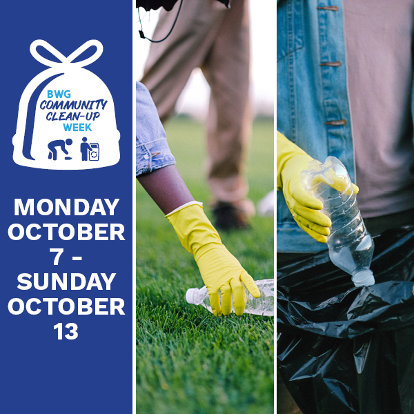 Image of people wearing yellow plastic gloves and cleaning up garbage on the grass